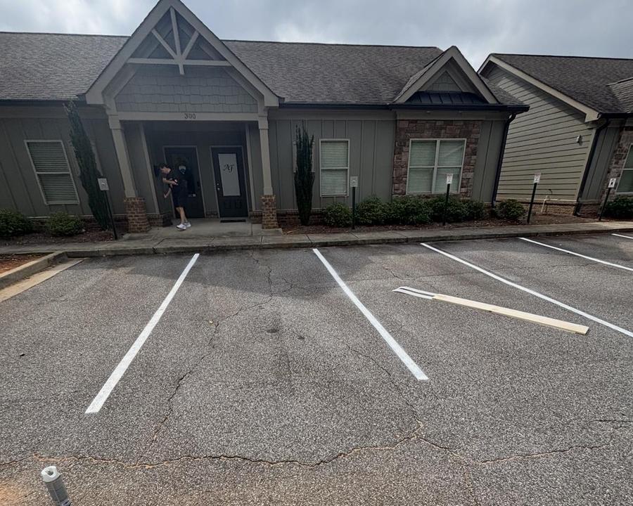 The same parking lot with freshly painted white stall lines